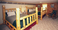 This large room has 1 King and 1 Queen hand-made Wisconsin native white pine log�beds.