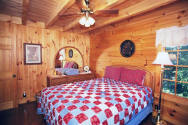 This room has beautiful solid oak furniture with a queen-size bed